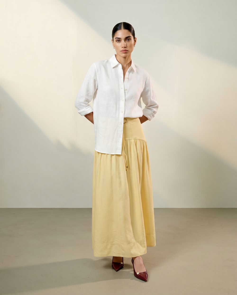 Editorial fashion visual — white shirt and yellow skirt