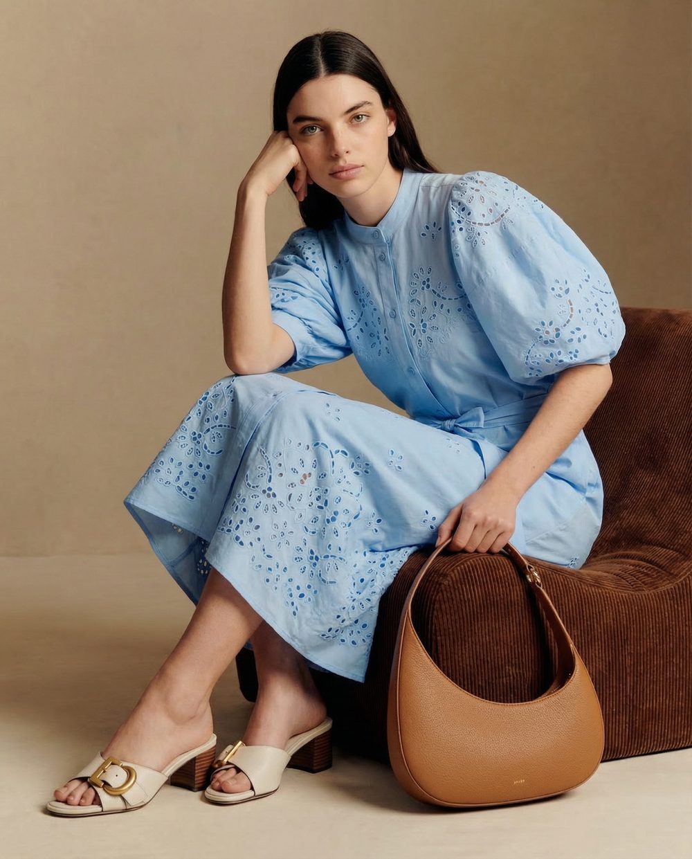 Editorial fashion visual — blue embroidered dress